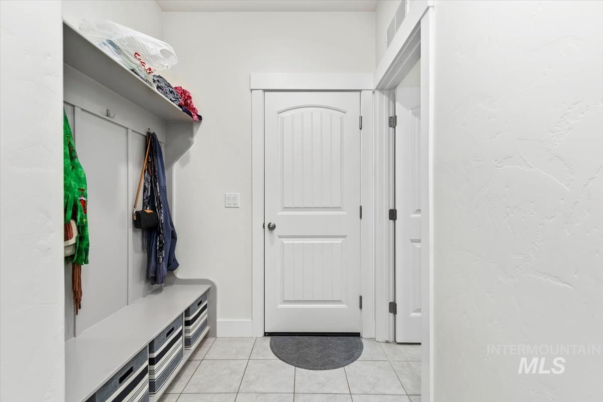Mudroom featuring light tile patterned floors