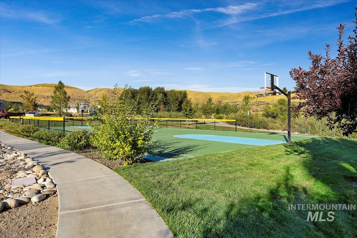 View of sport court with community basketball court and a mountain view