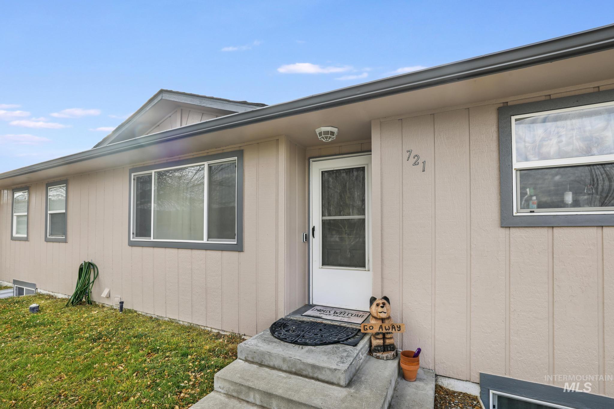 Property entrance with a lawn