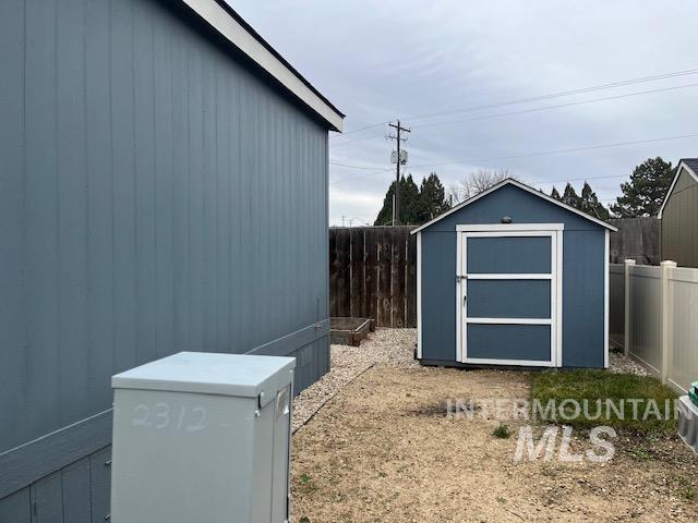 View of shed featuring a fenced backyard