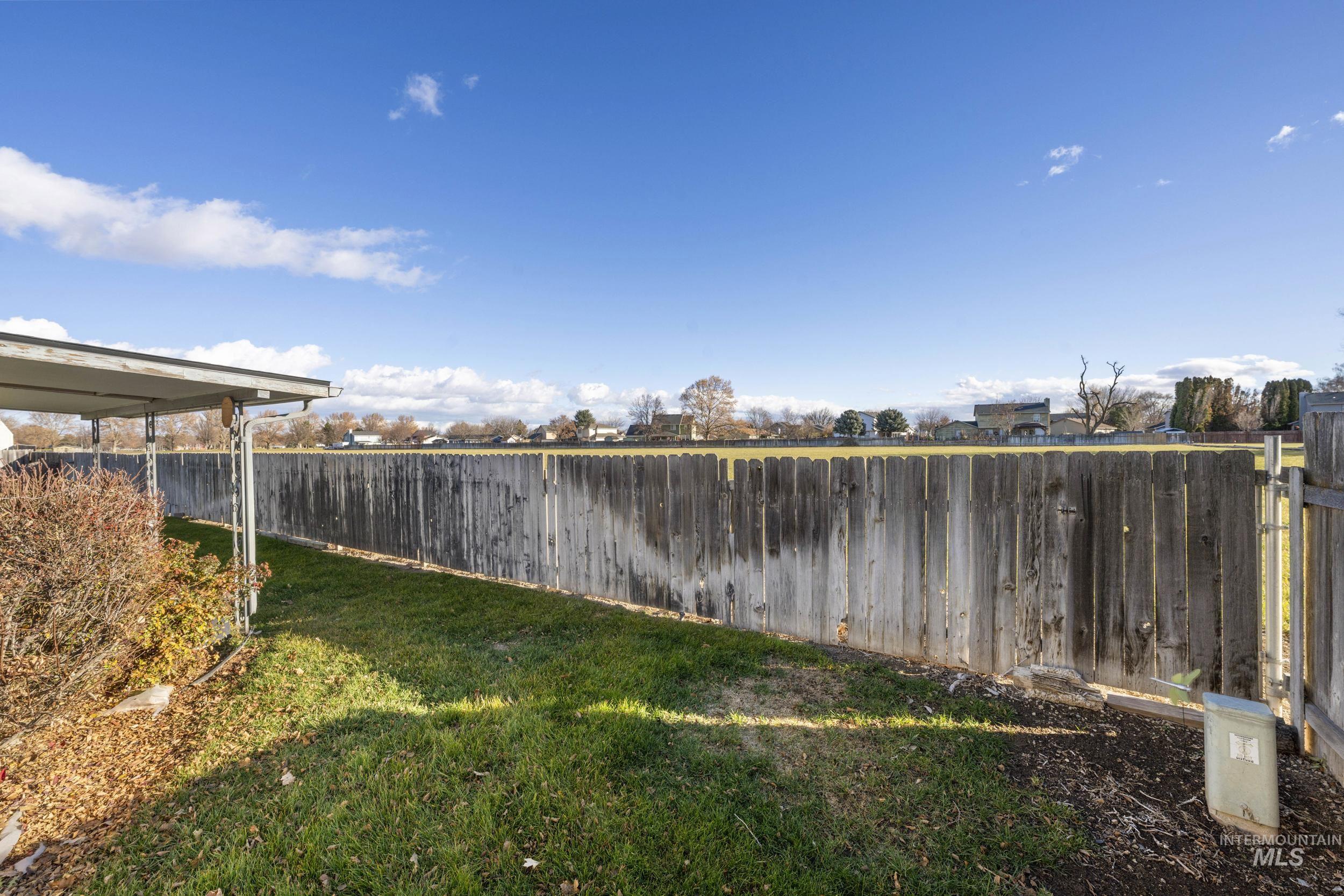 View of fenced backyard