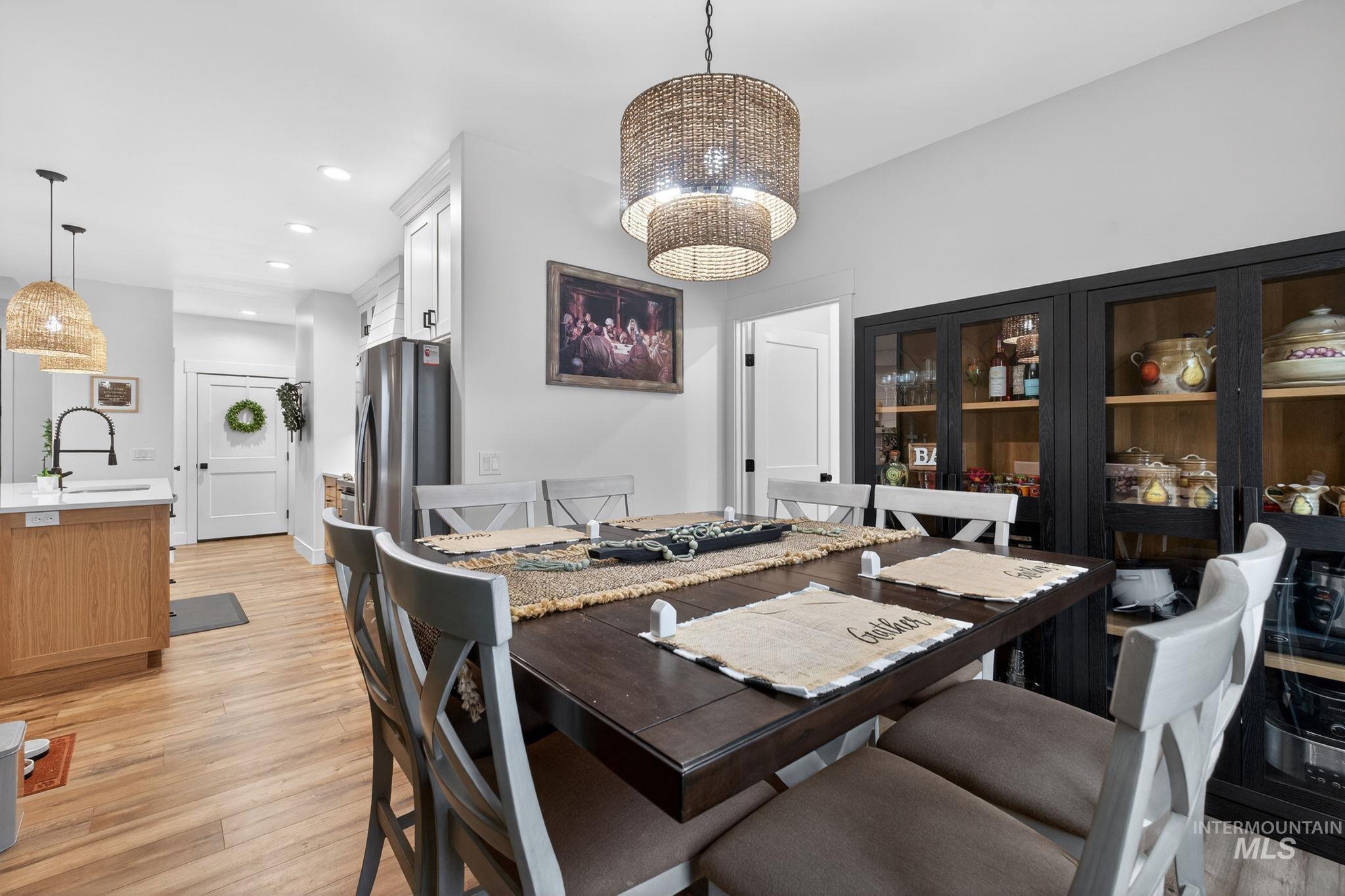 Dining room featuring light wood finished floors and recessed lighting