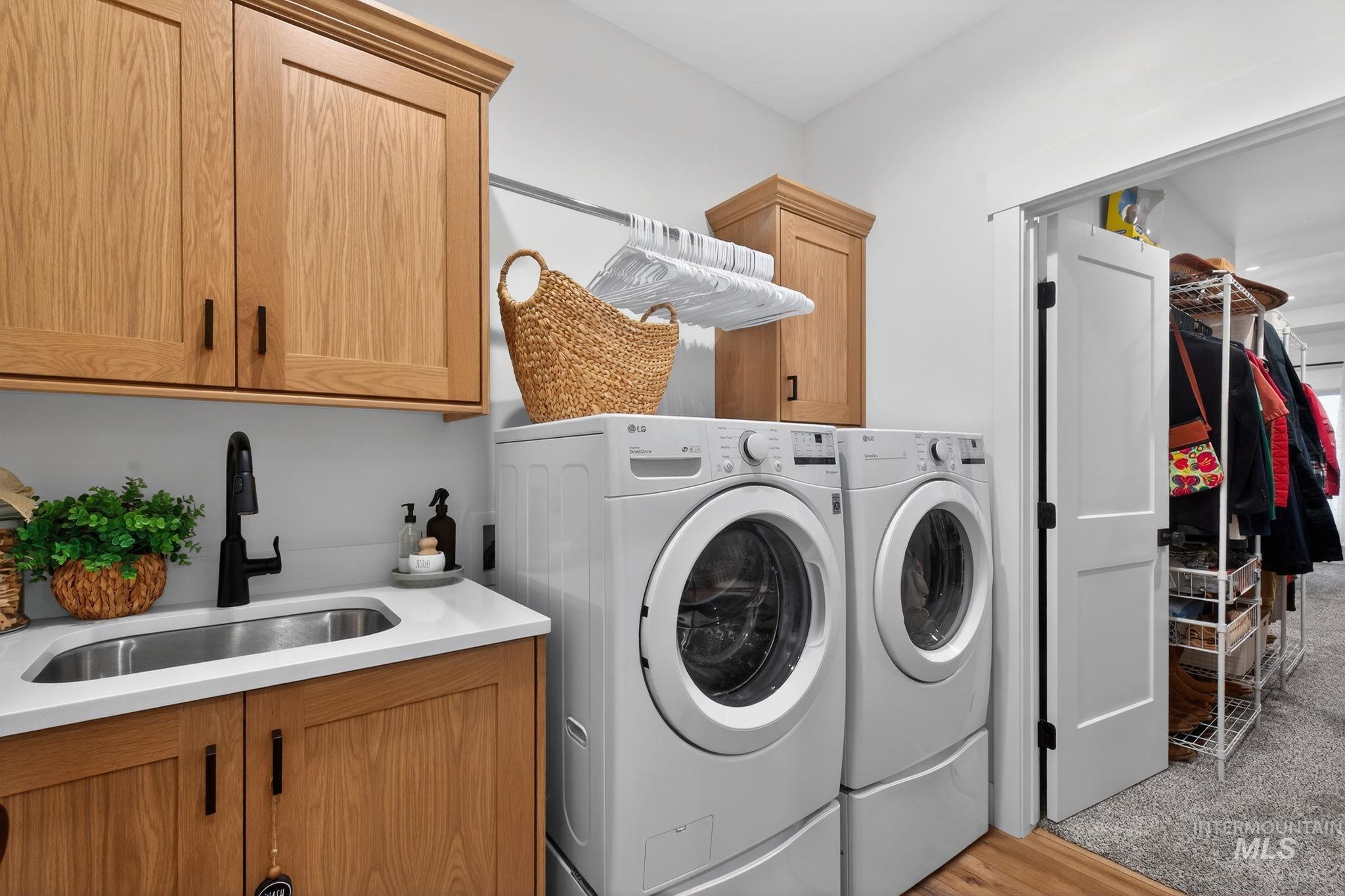 Laundry area featuring cabinet space and independent washer and dryer