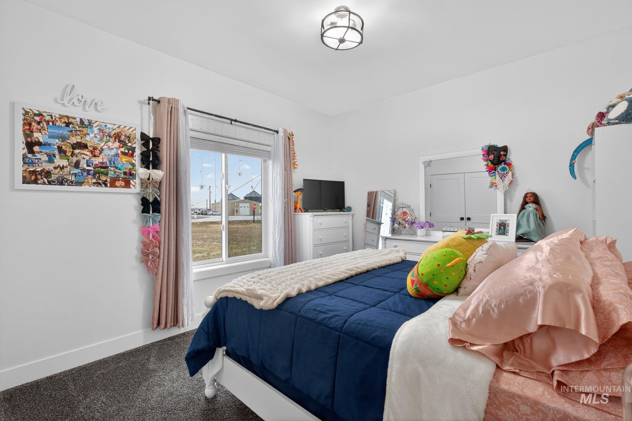 Carpeted bedroom with baseboards