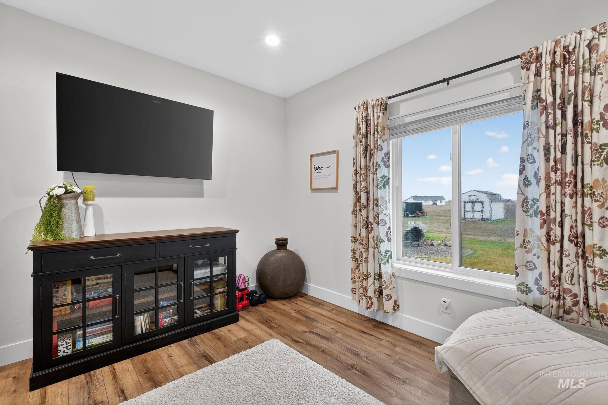 Bedroom featuring light wood finished floors and recessed lighting