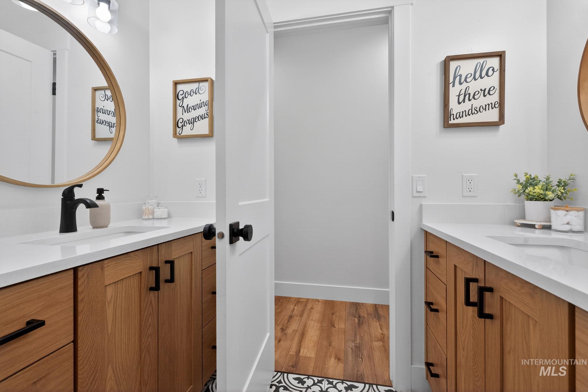 Bathroom with vanity and light wood-style floors