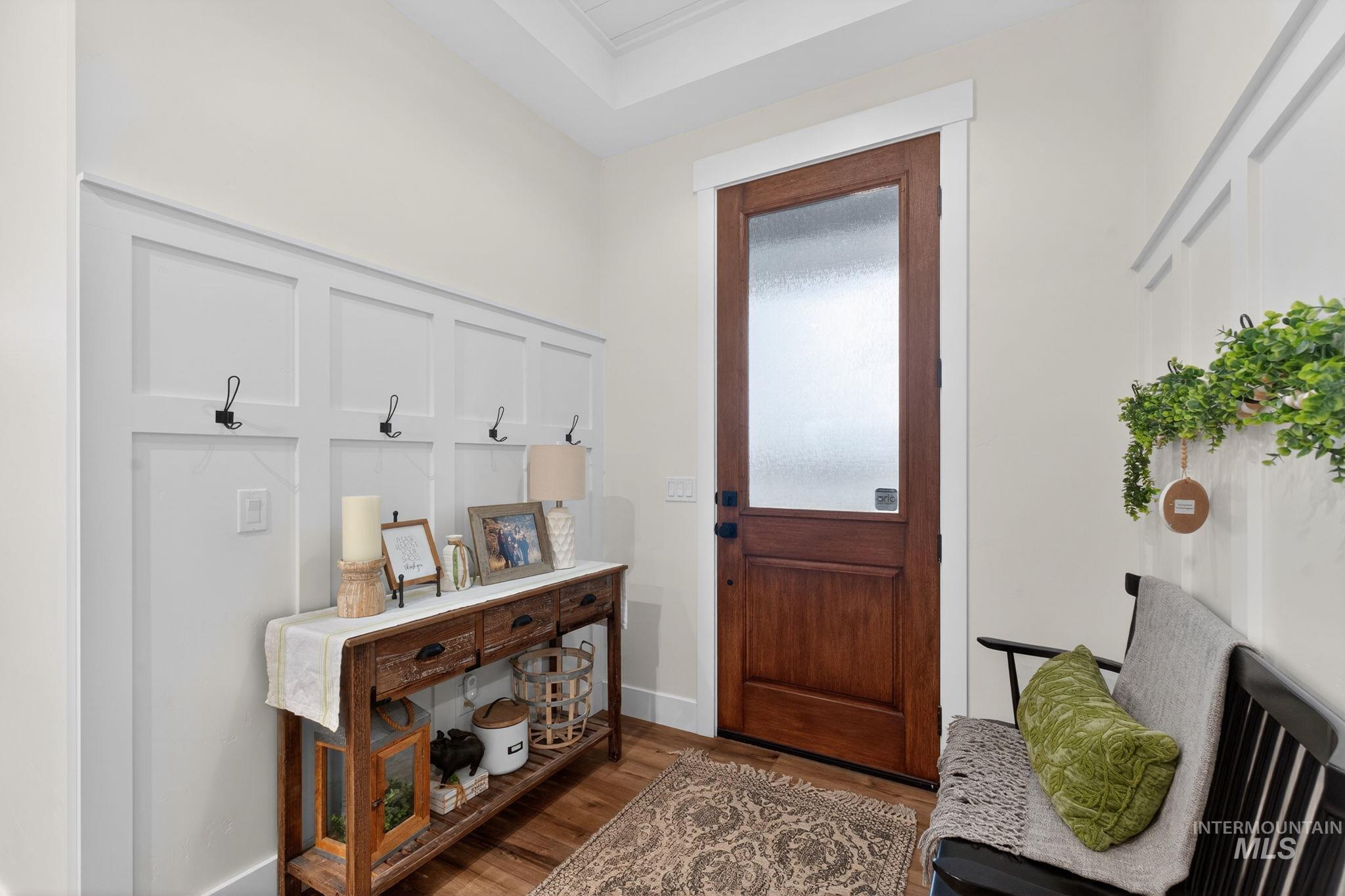 Foyer with wood finished floors