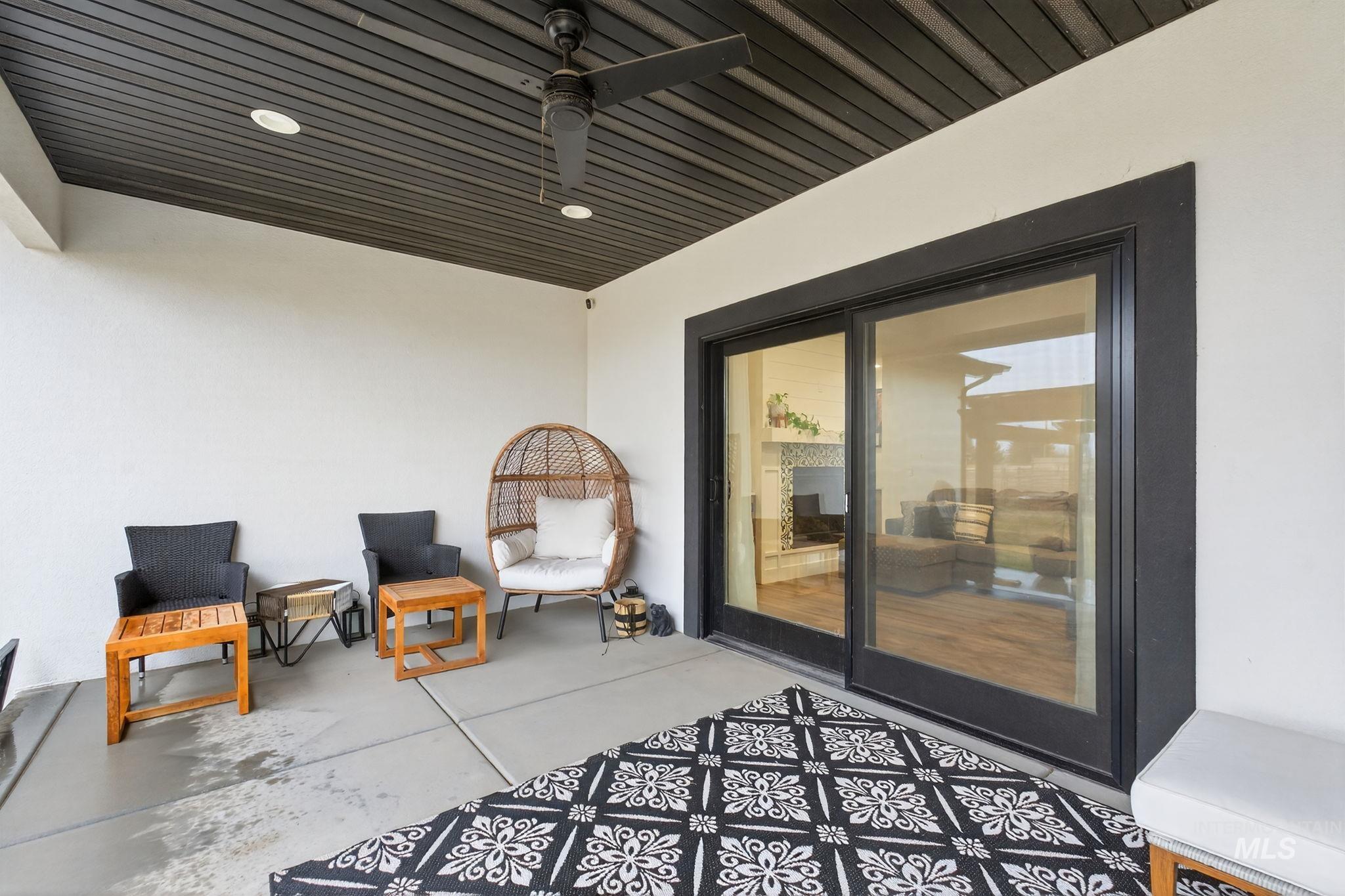 View of patio featuring a ceiling fan