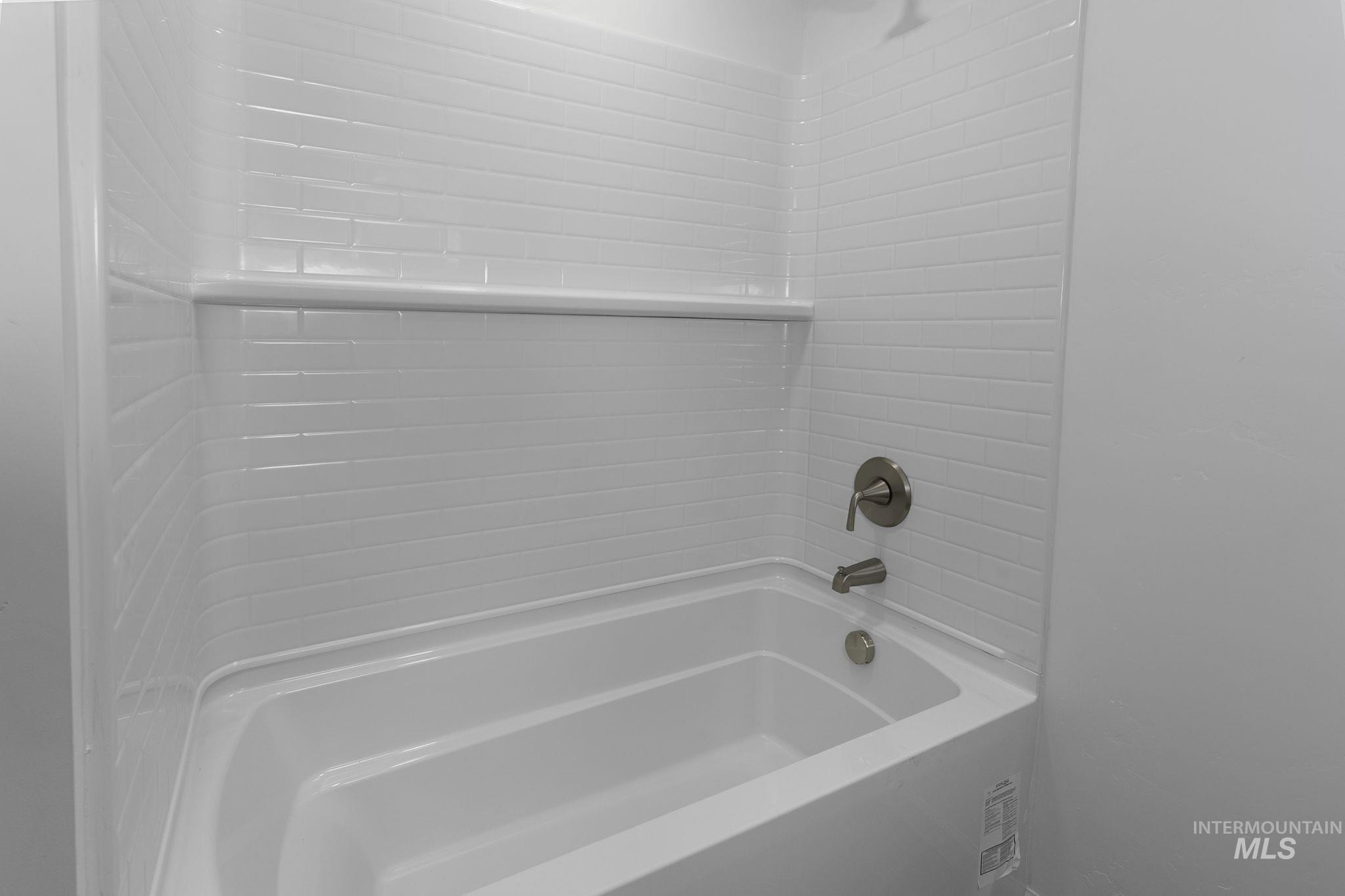 Bathroom with bathing tub / shower combination
