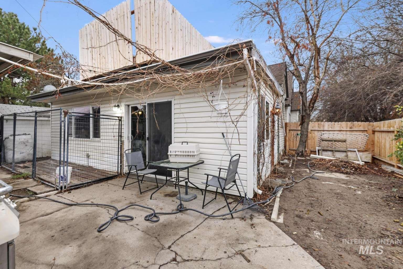 Back of house with a patio area