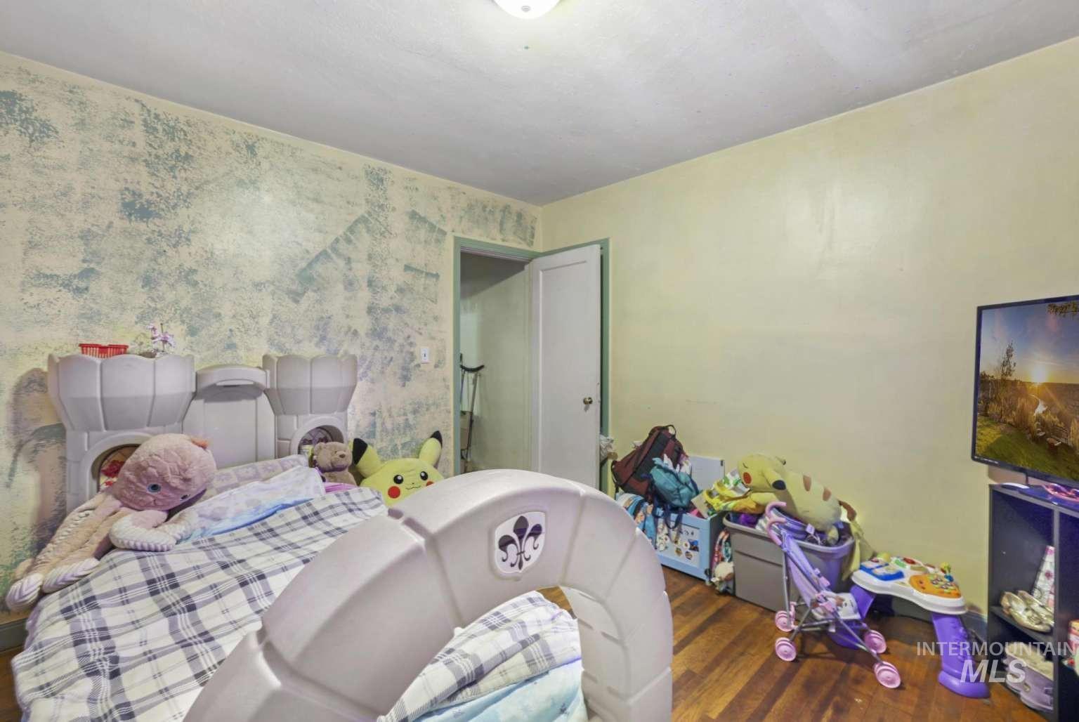 Bedroom featuring wood finished floors