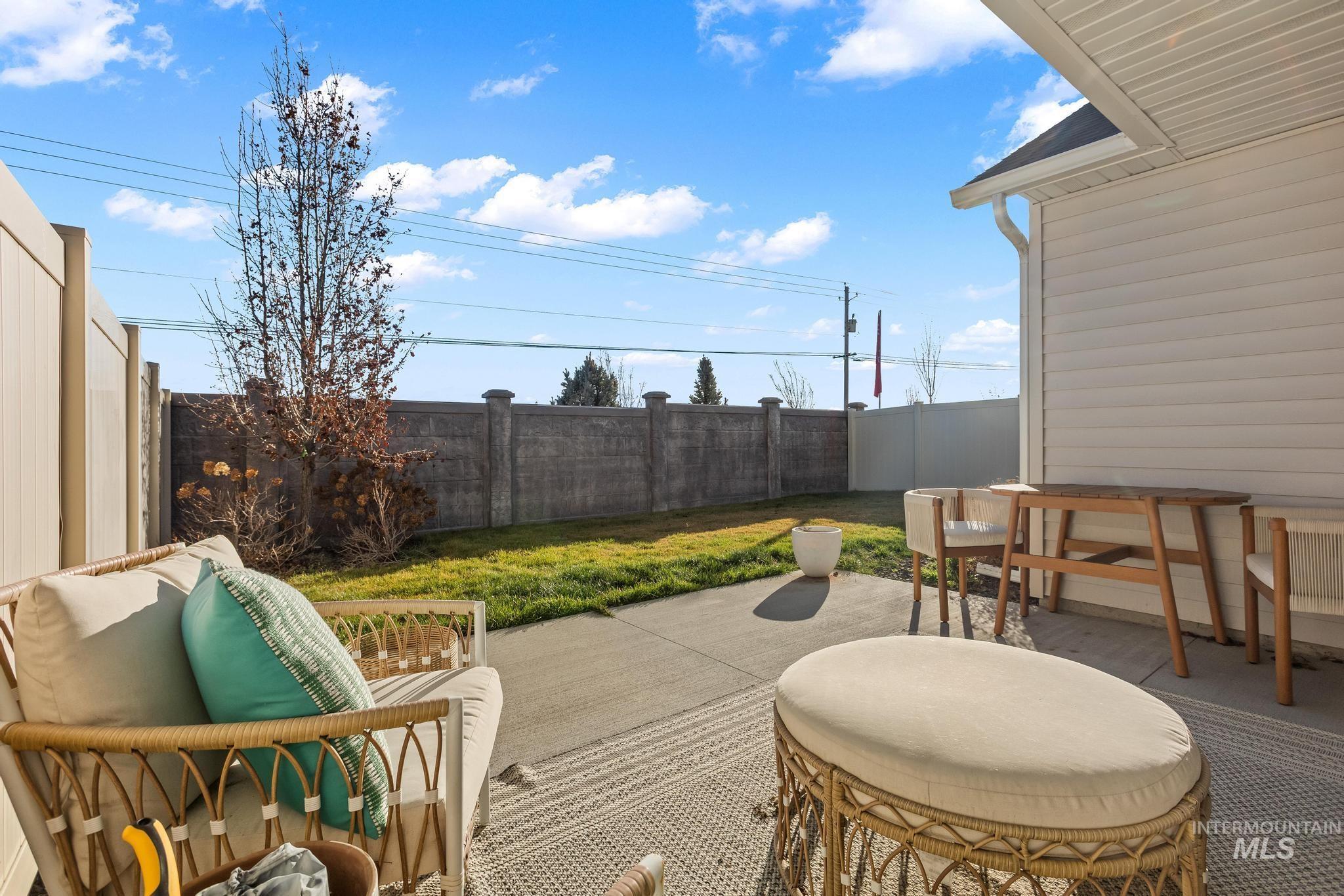 Fenced backyard featuring a patio area and outdoor dining space