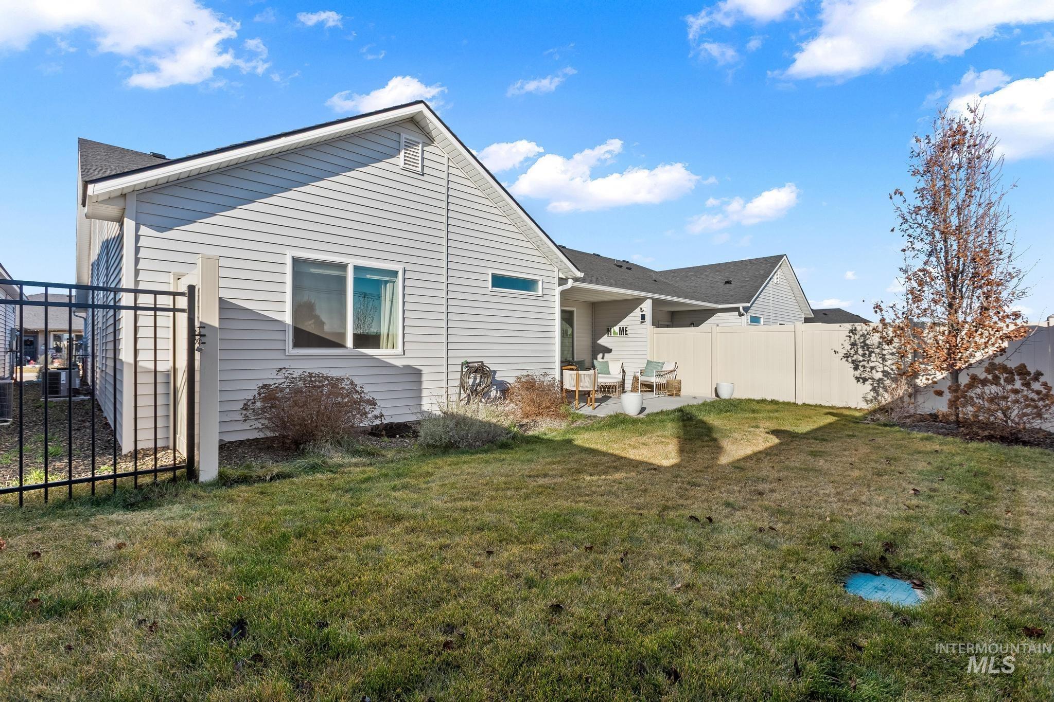 Rear view of house featuring a patio