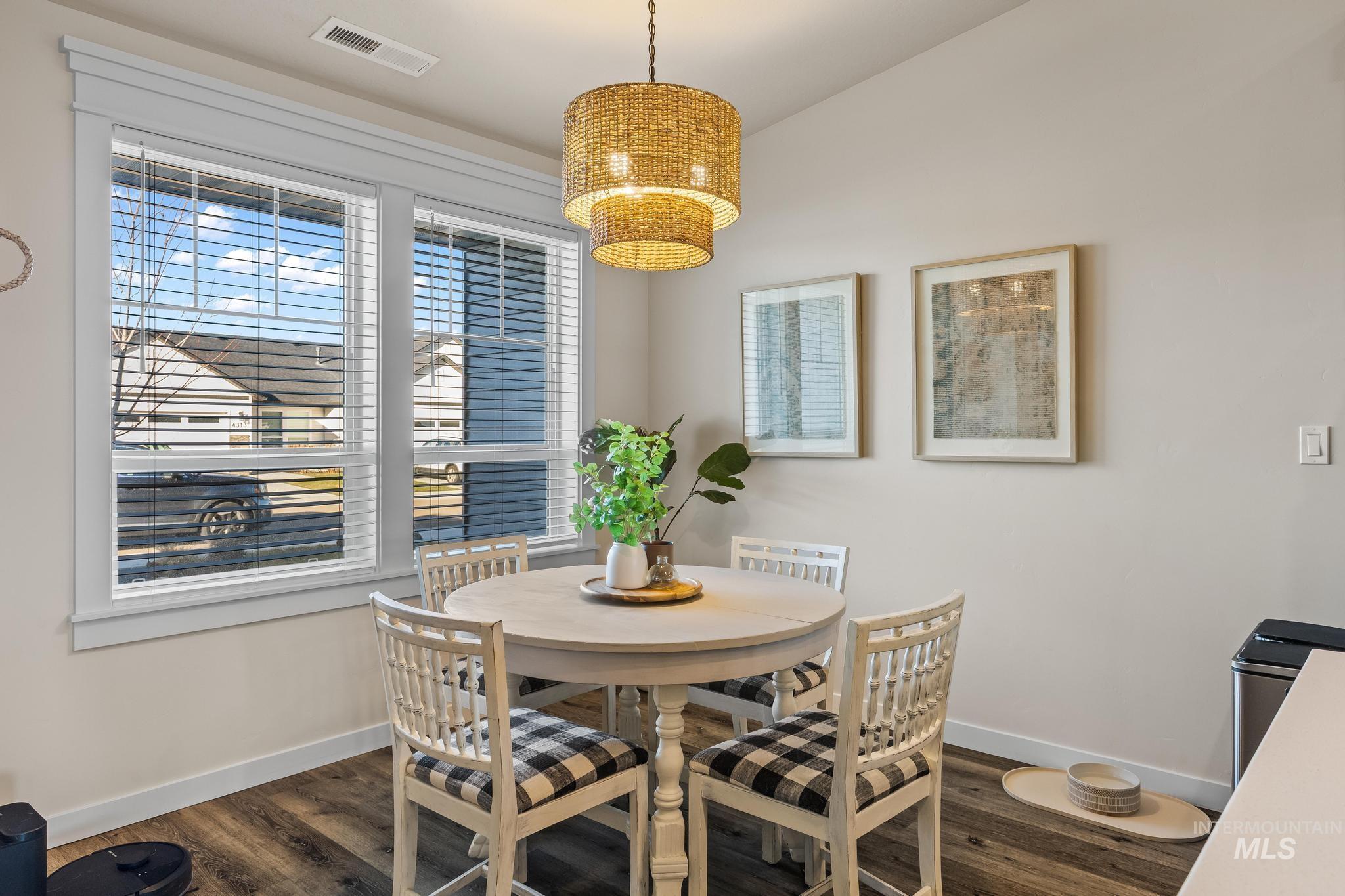 Dining room with dark wood-type flooring