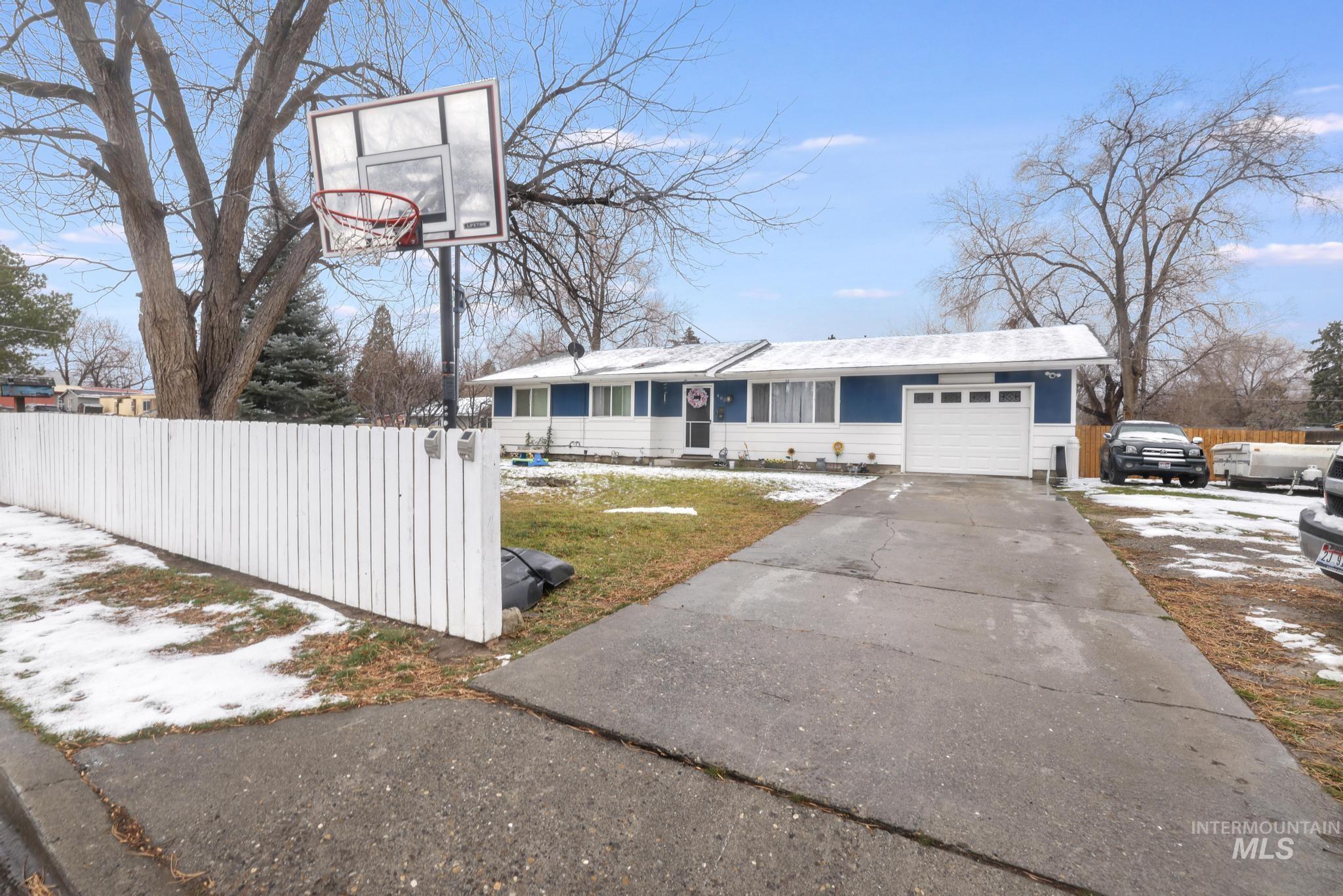 View of front of home featuring driveway and an attached garage