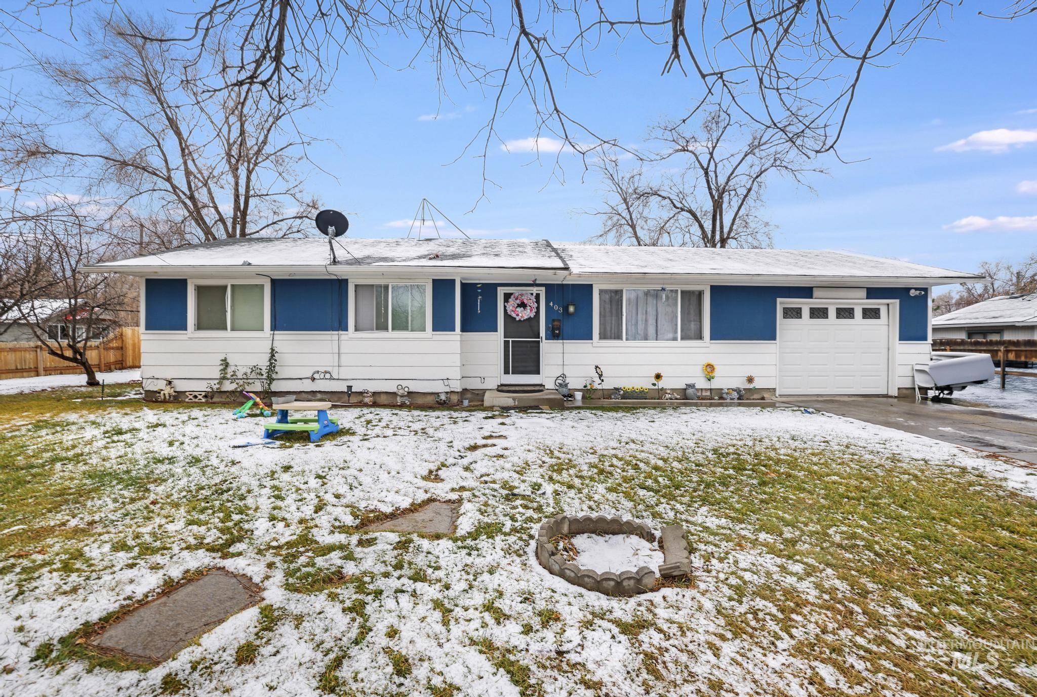 Single story home with an attached garage and driveway