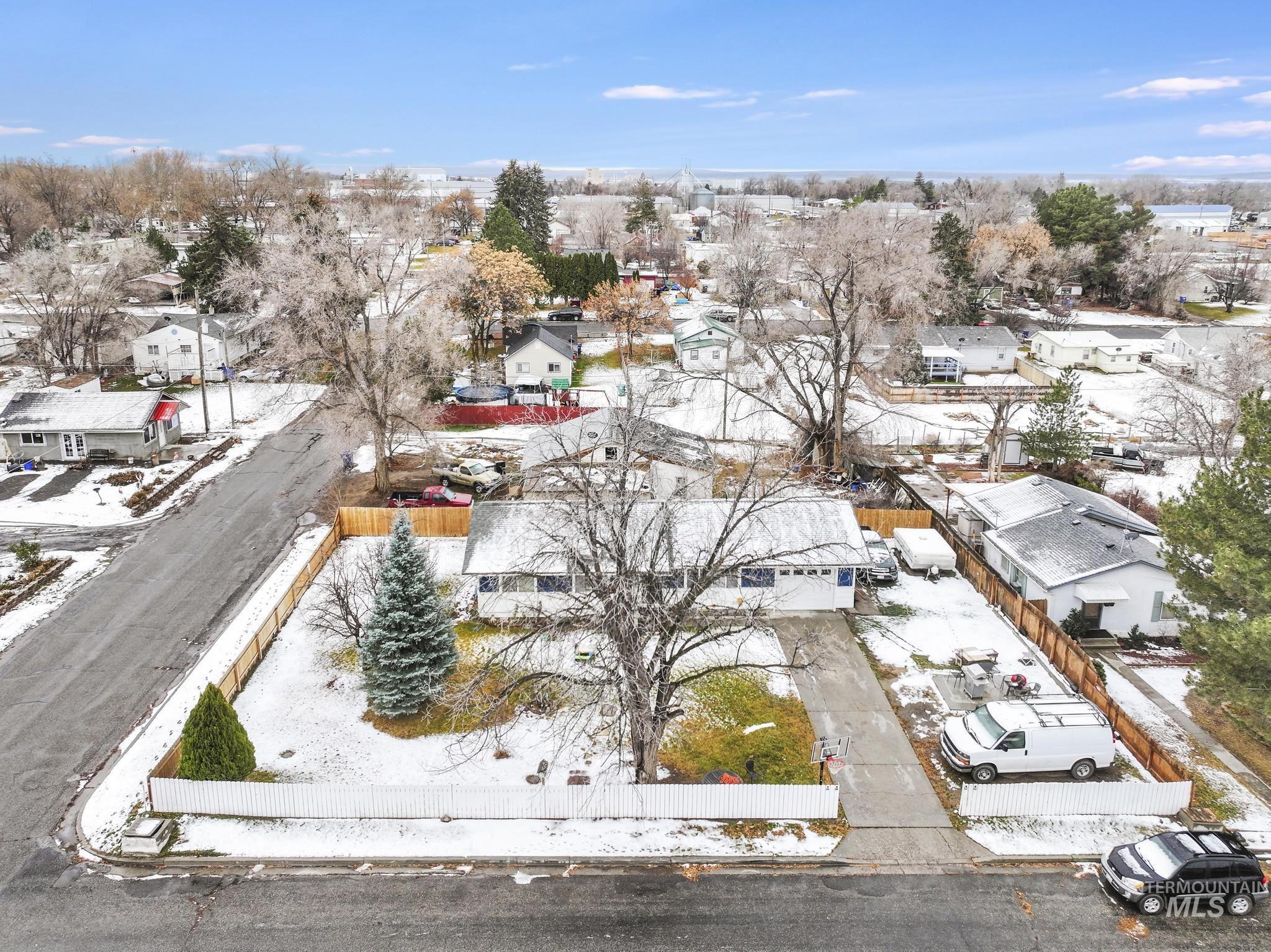 Snowy aerial view featuring a residential view