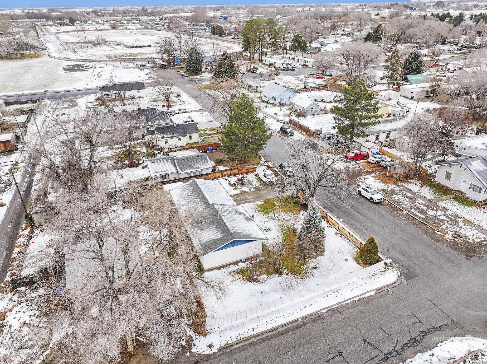Snowy aerial view featuring a residential view