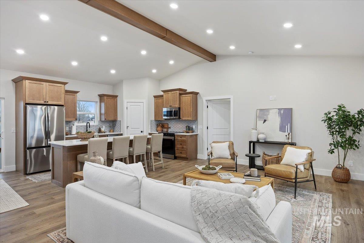 Living room featuring light wood-style floors and recessed lighting