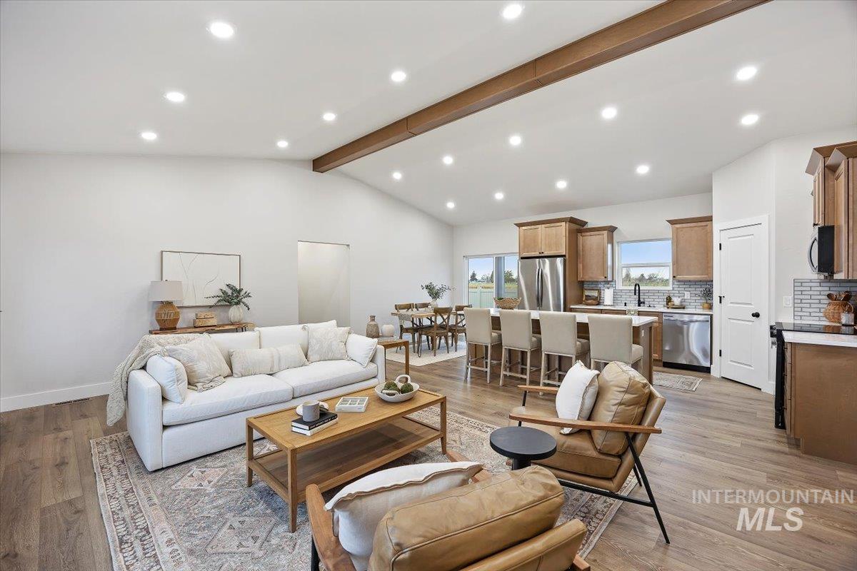 Living room with recessed lighting and light wood-style floors