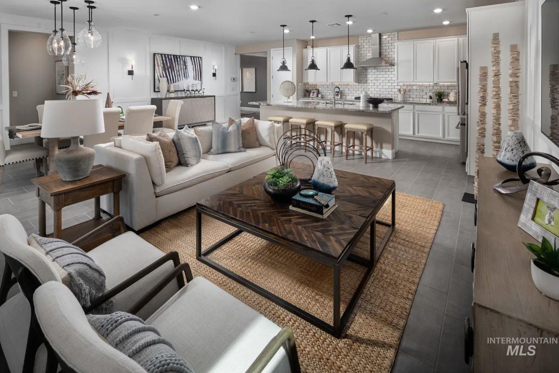 Living area with recessed lighting and dark tile patterned floors