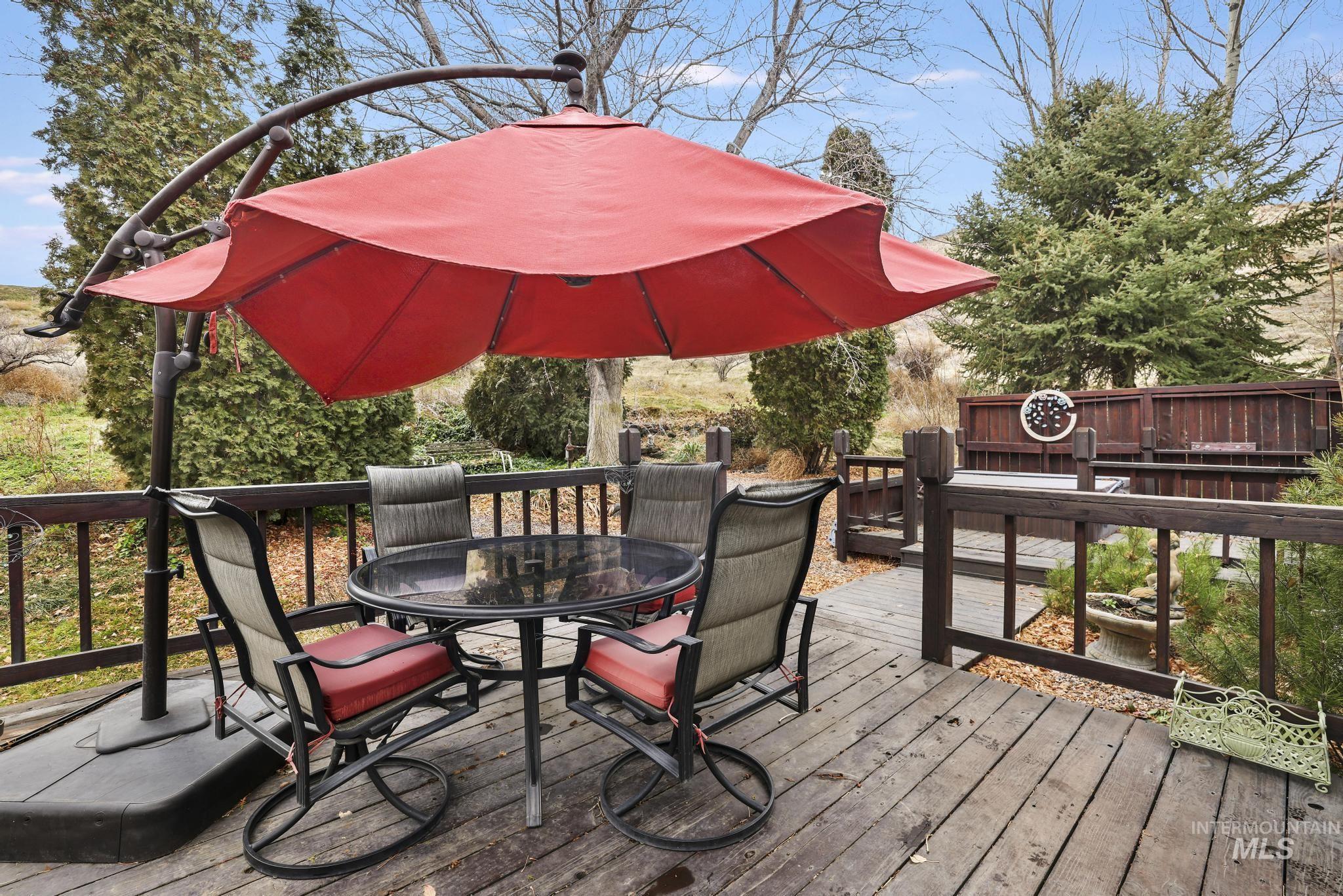 Wooden terrace featuring outdoor dining space