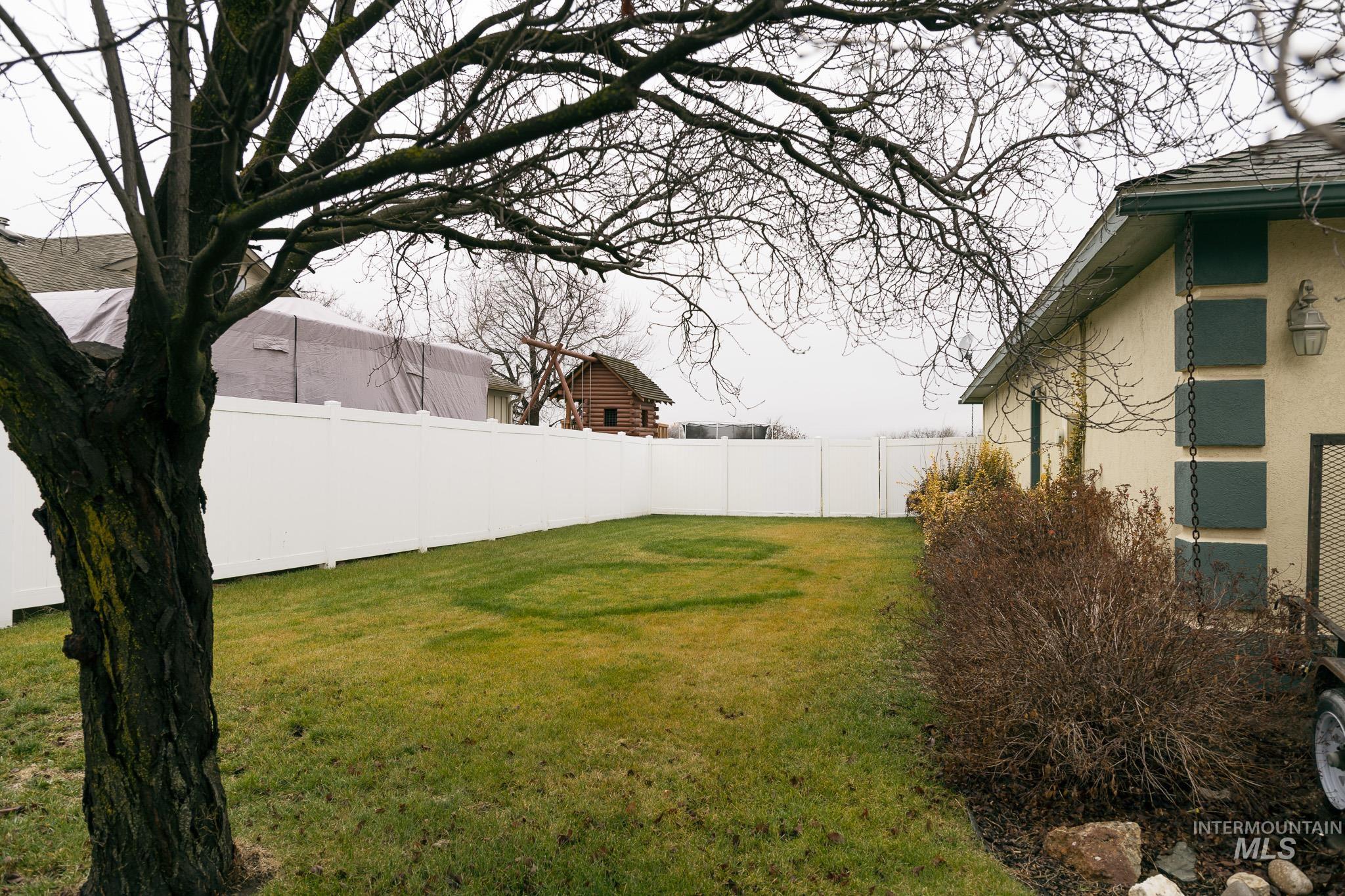 View of fenced backyard