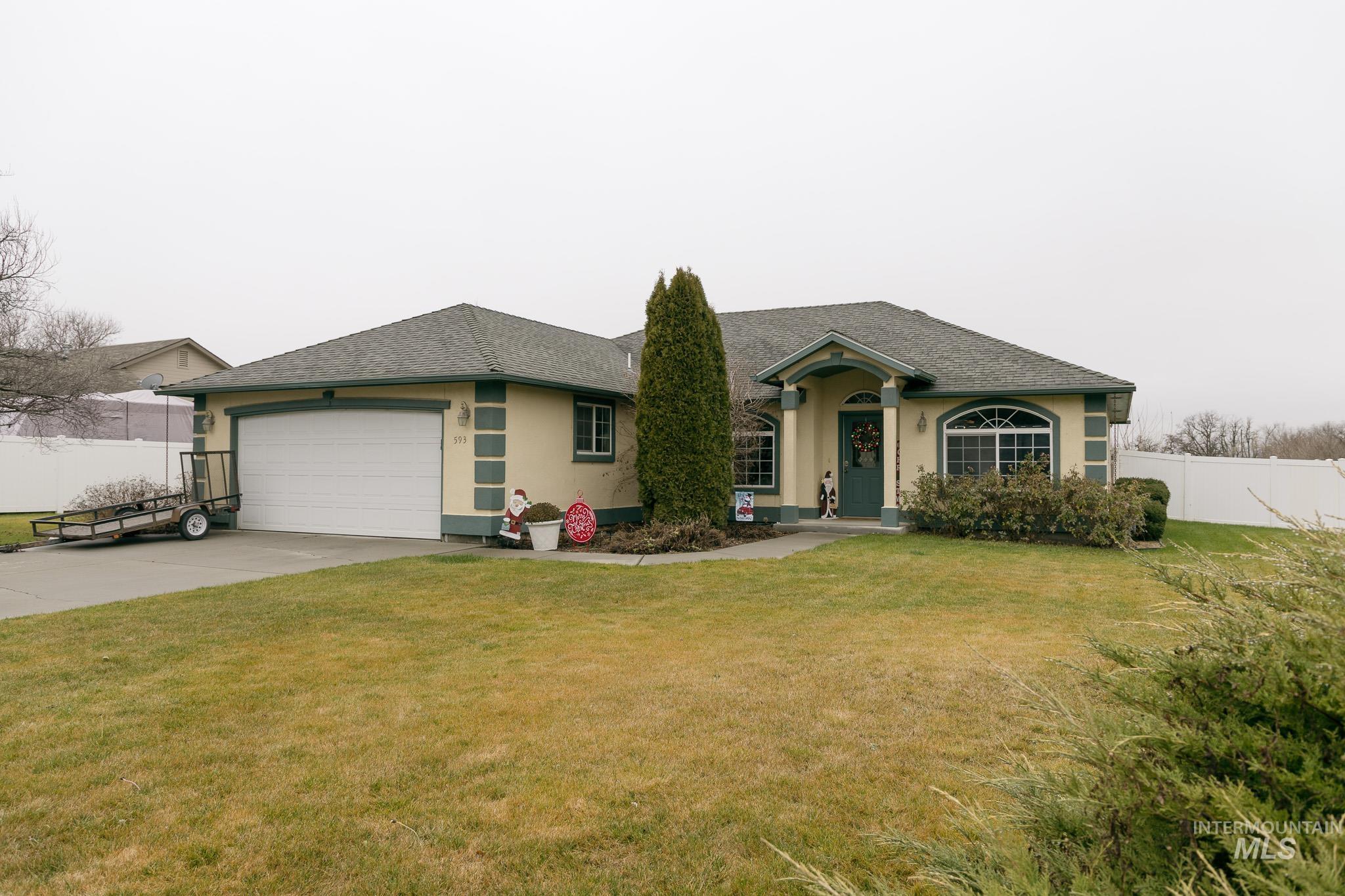 Single story home featuring stucco siding, driveway, a shingled roof, and a garage