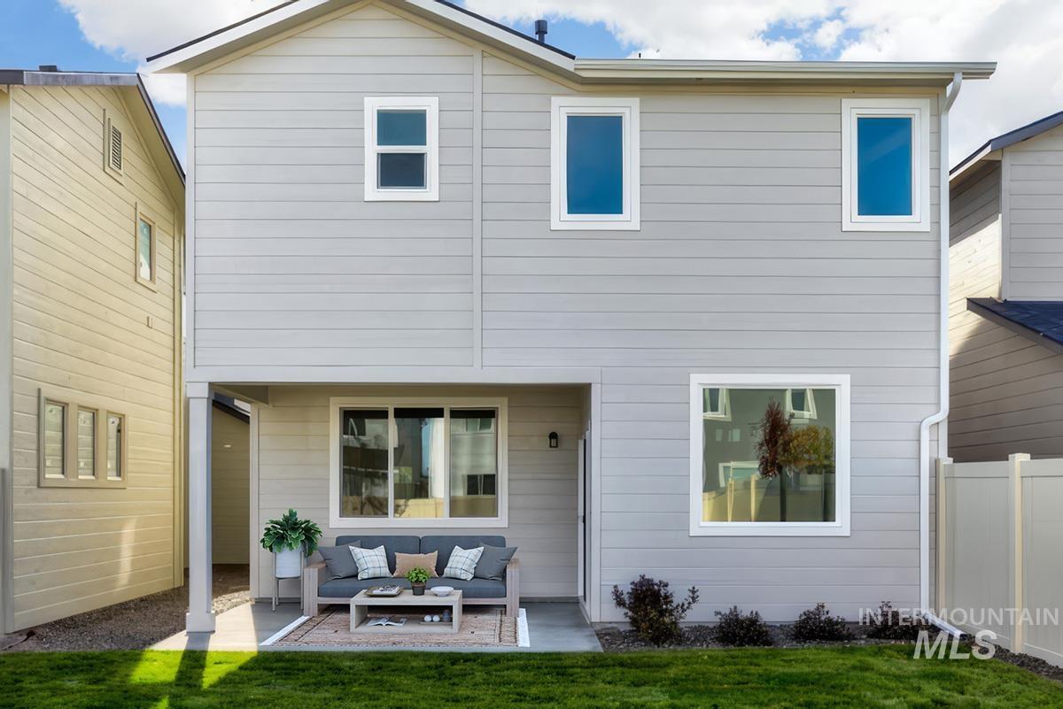 Back of property with an outdoor living space and a patio area