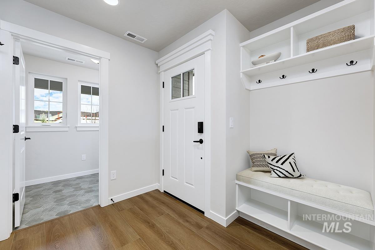 Mudroom featuring wood finished floors and recessed lighting