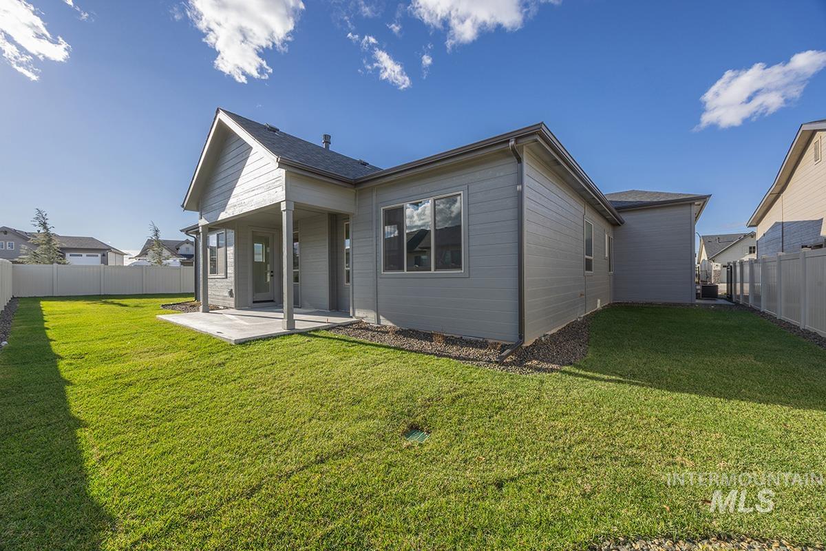 Back of house featuring a fenced backyard and a patio area