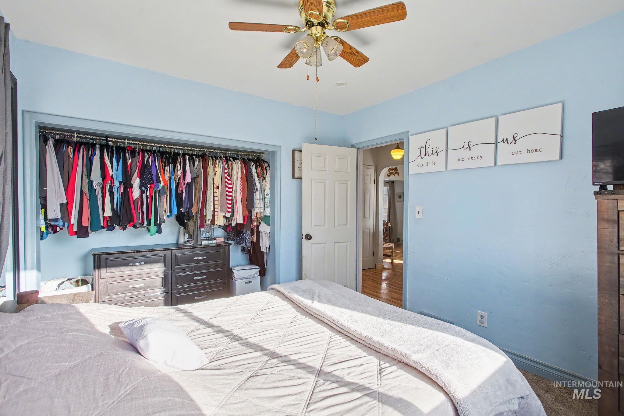 Bedroom featuring a closet and a ceiling fan