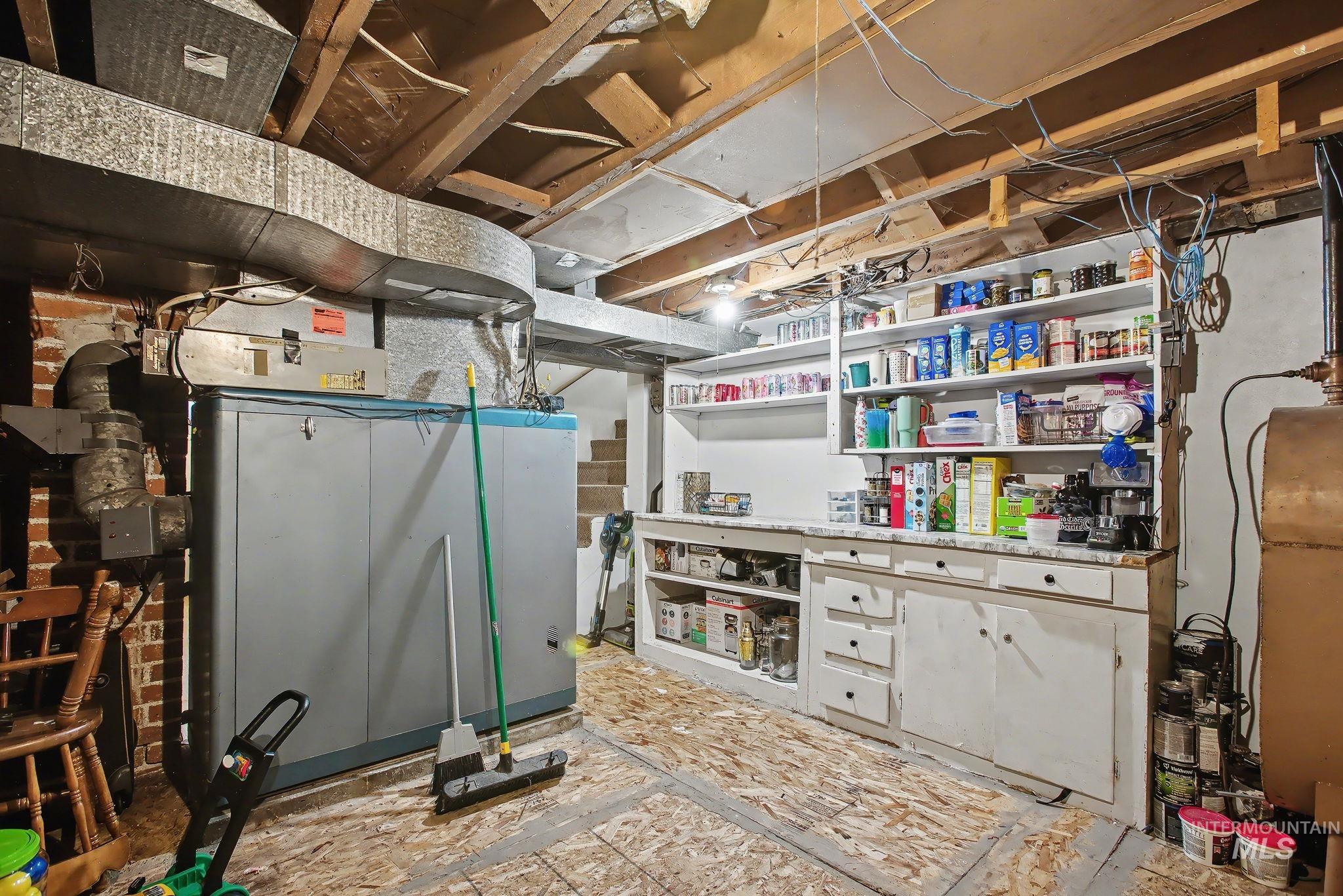 Unfinished basement featuring oil tank