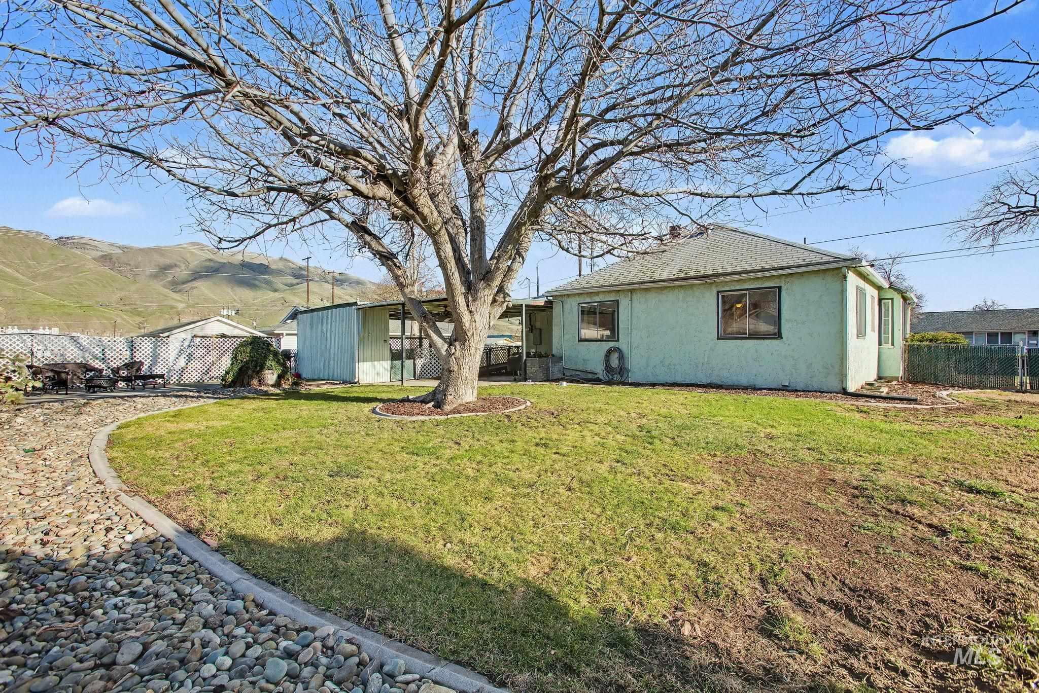 Rear view of property with stucco siding