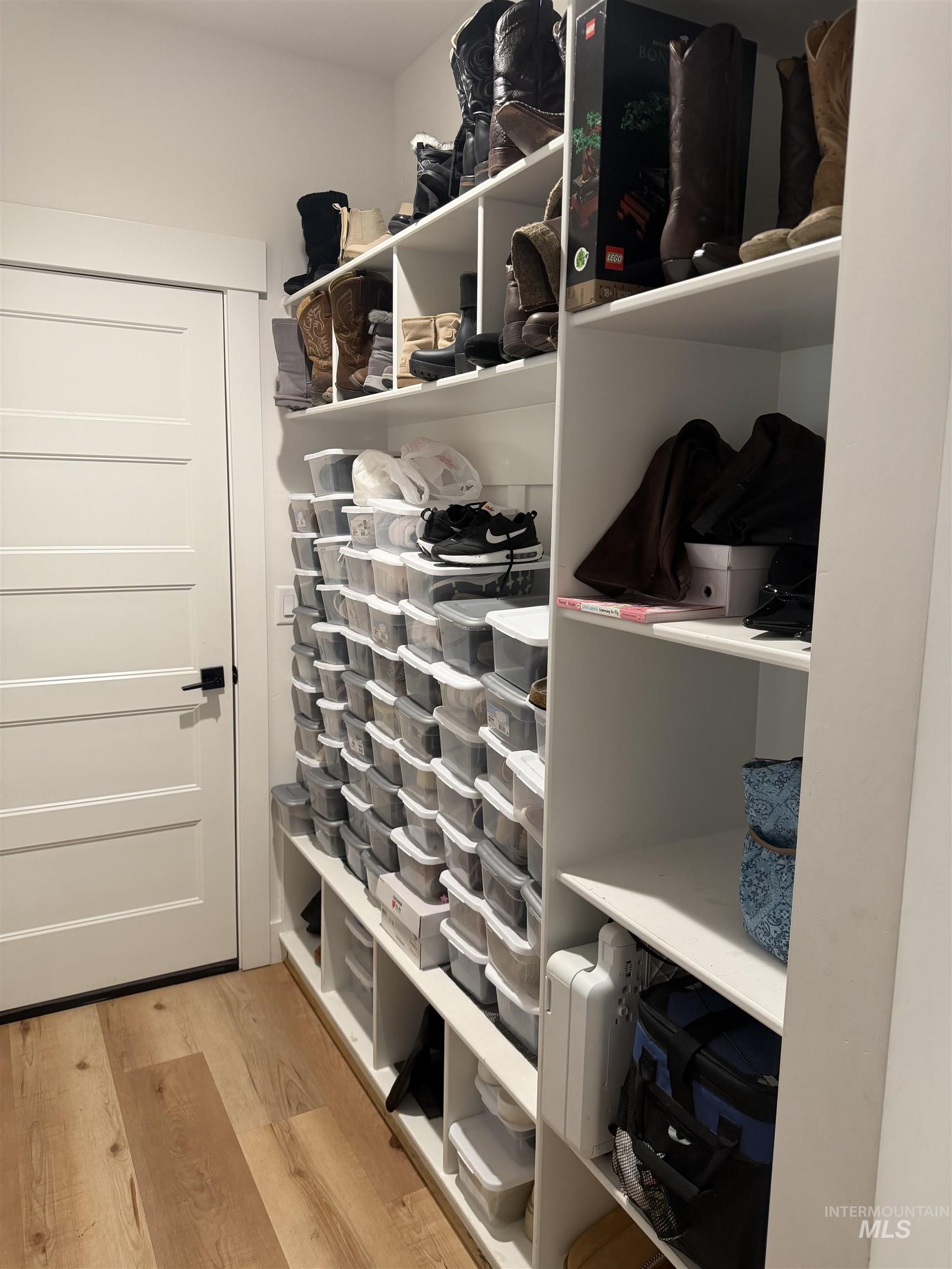 Mudroom featuring light wood-style floors