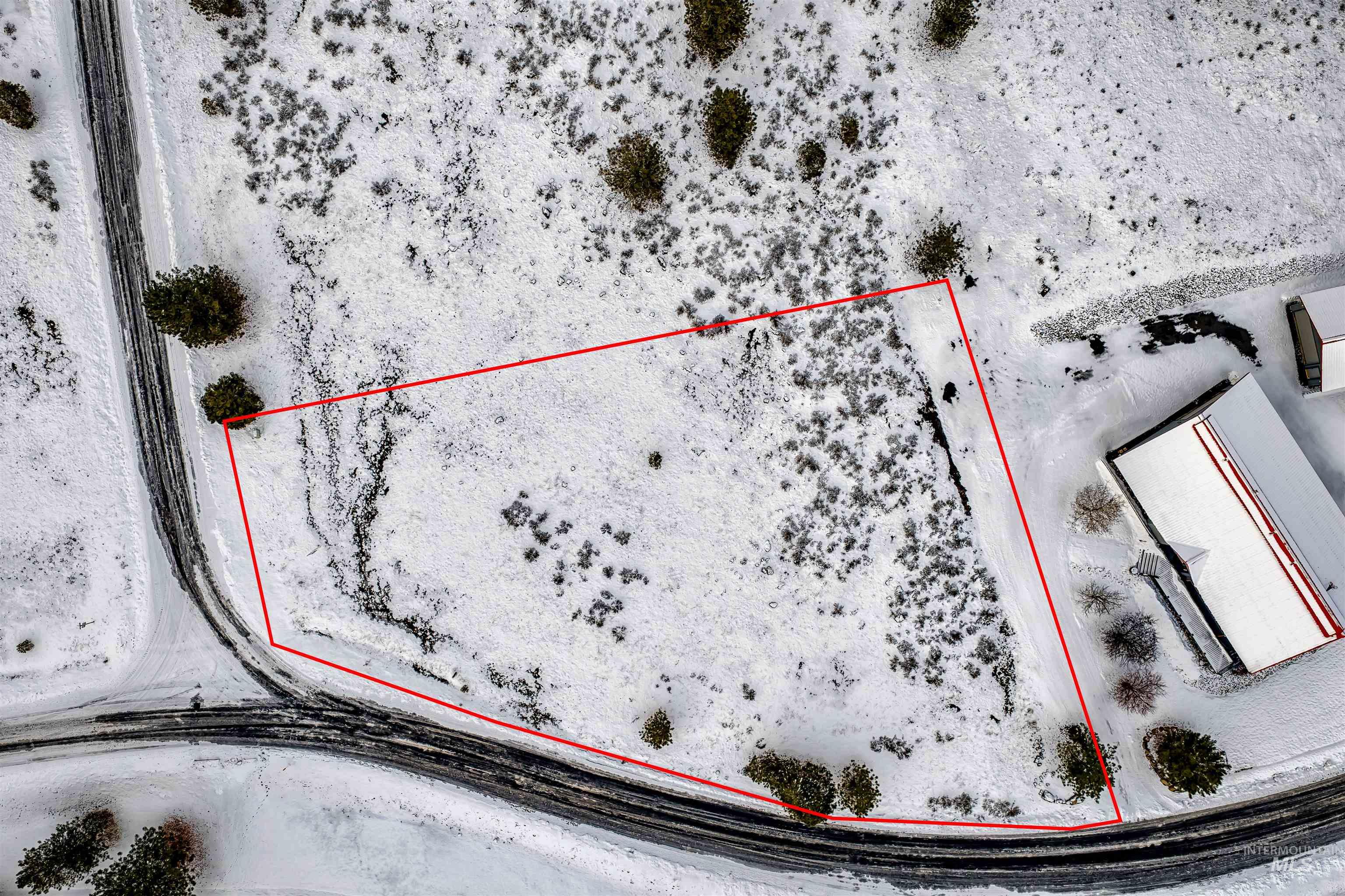 Aerial overview of property's location with property parcel outlined