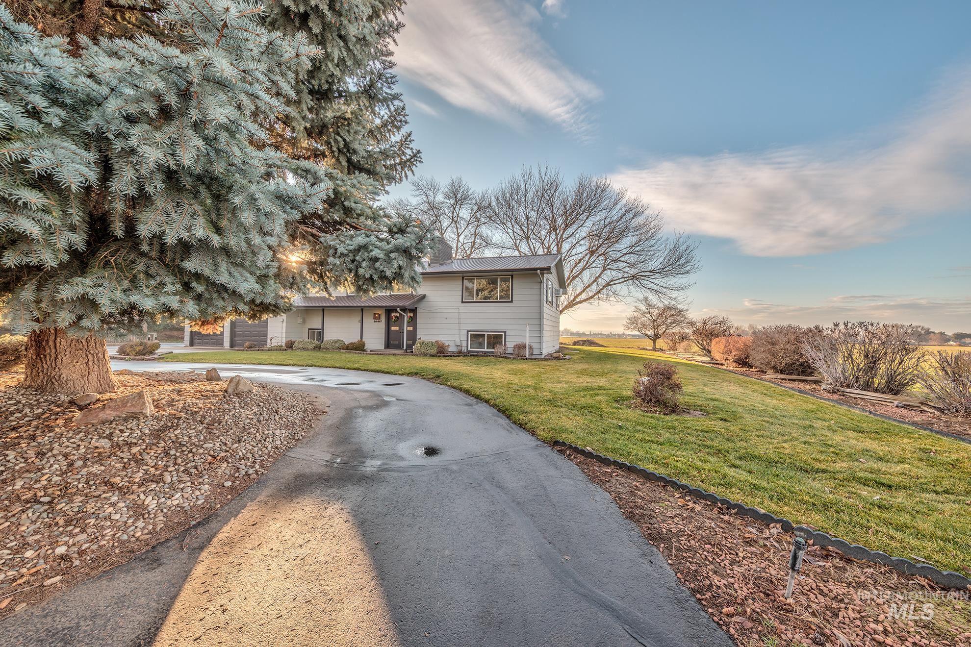 Split level home featuring a front yard