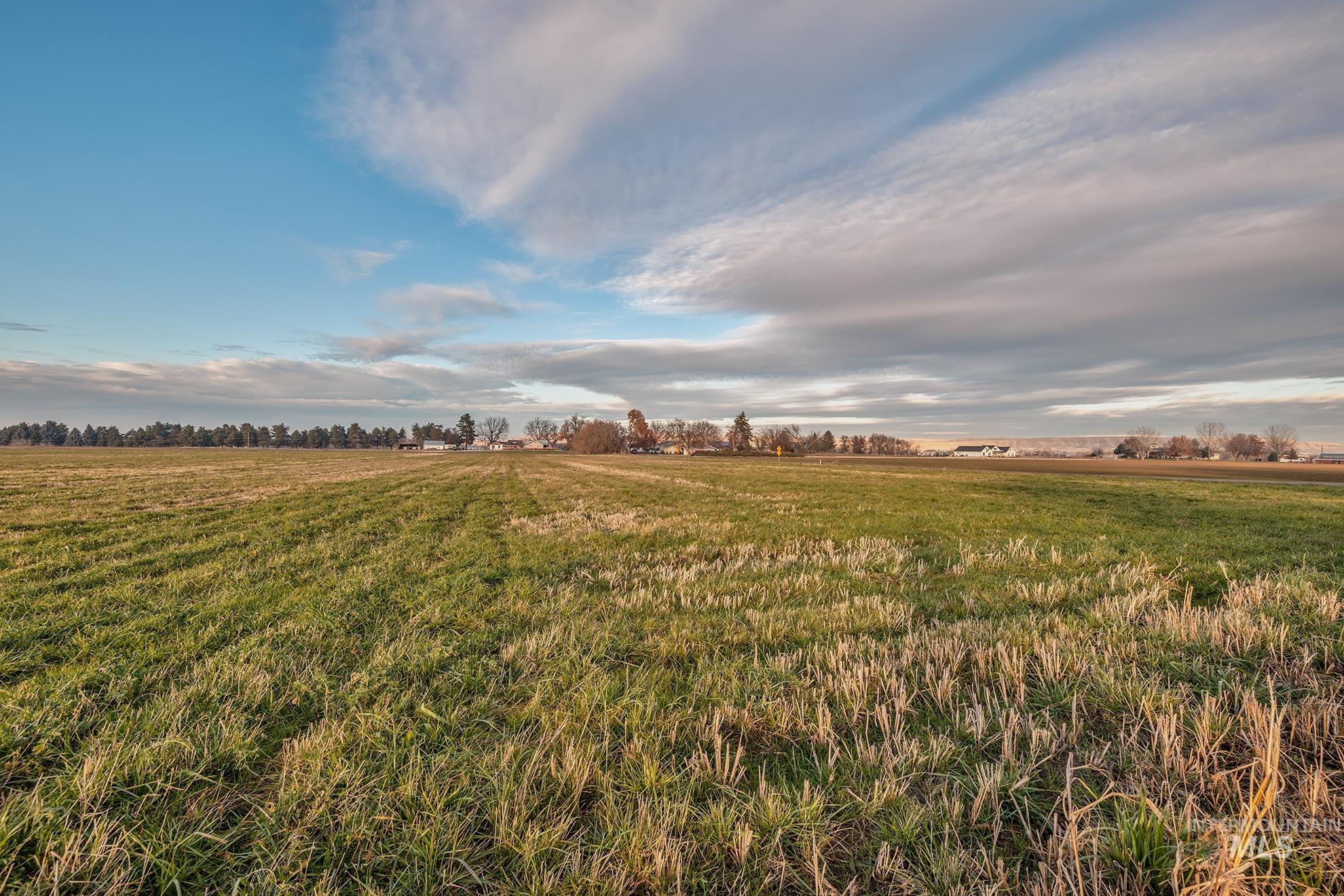 View of green lawn with a view of countryside