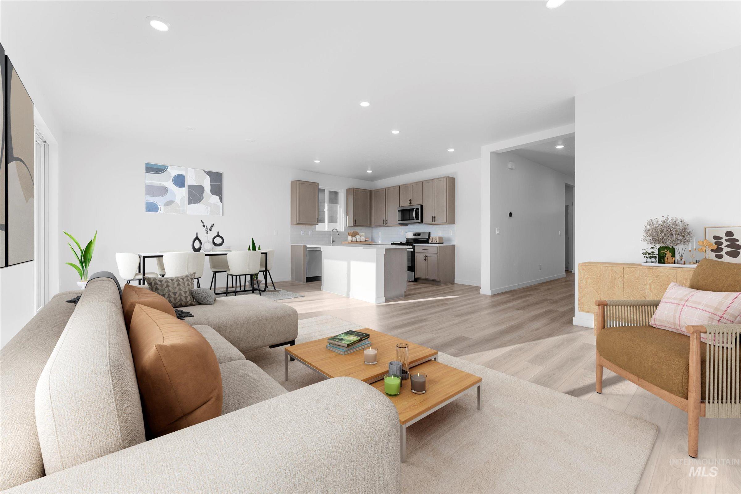 Living area with recessed lighting and light wood finished floors