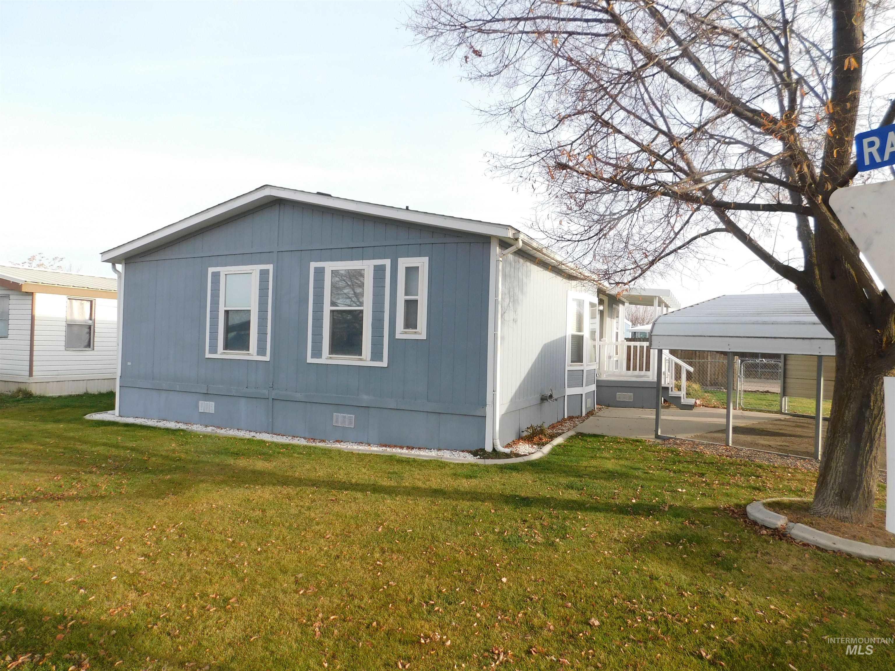 View of home's exterior with crawl space and a yard