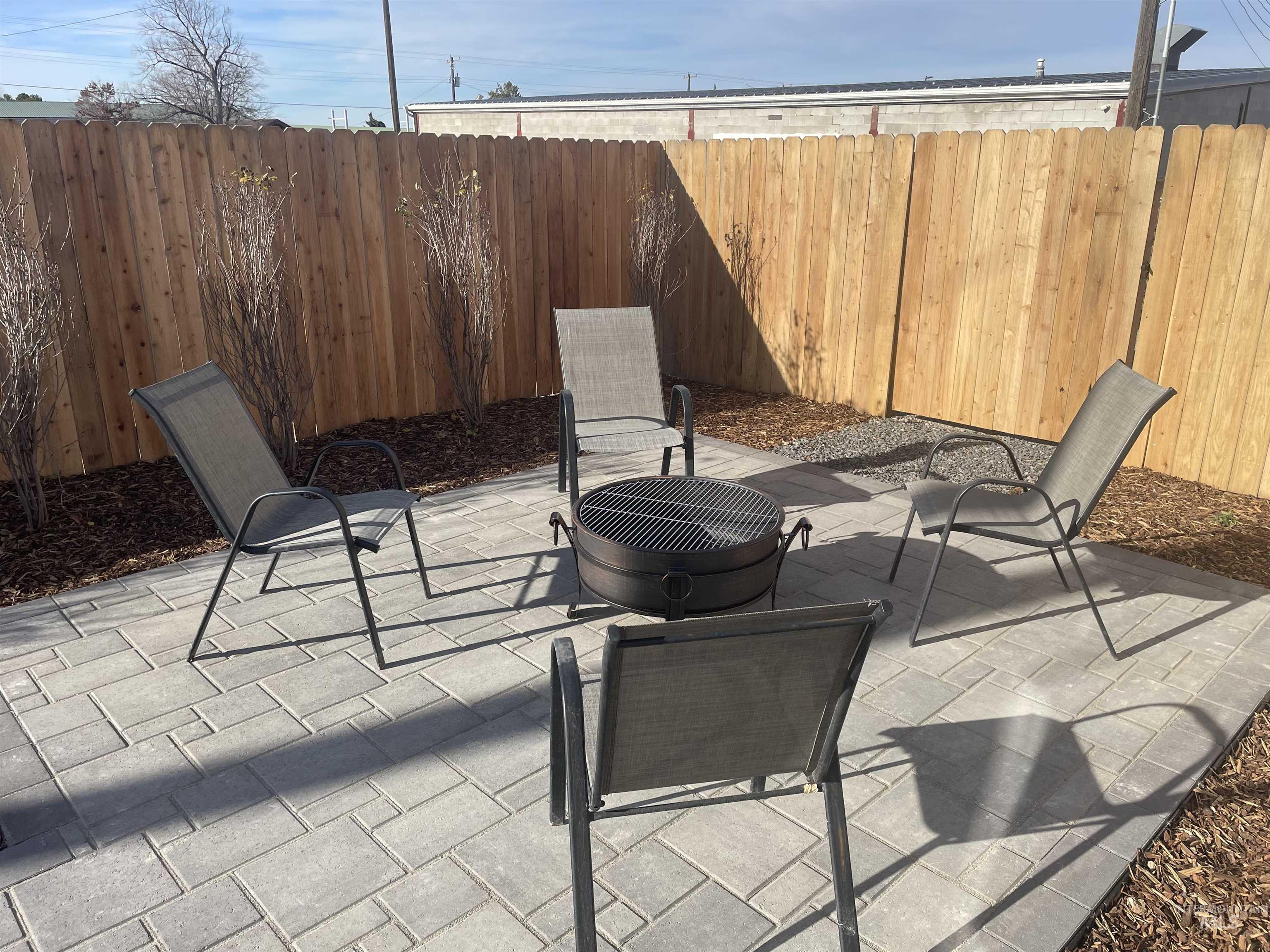 Fenced backyard with a patio area