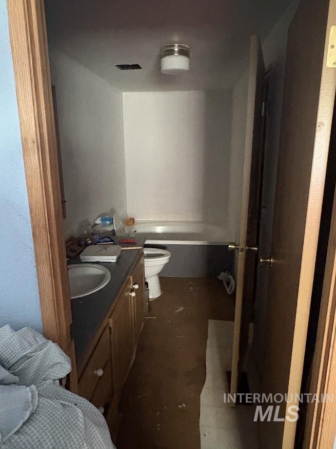 Bathroom with vanity and a tub to relax in