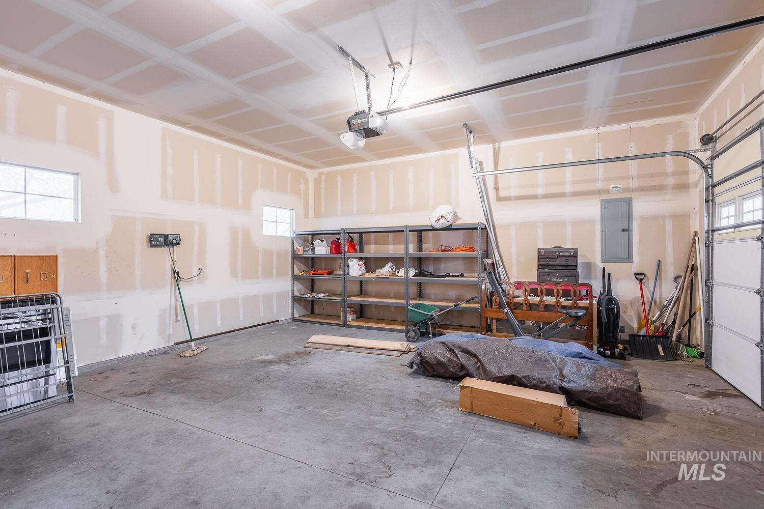 Garage featuring electric panel