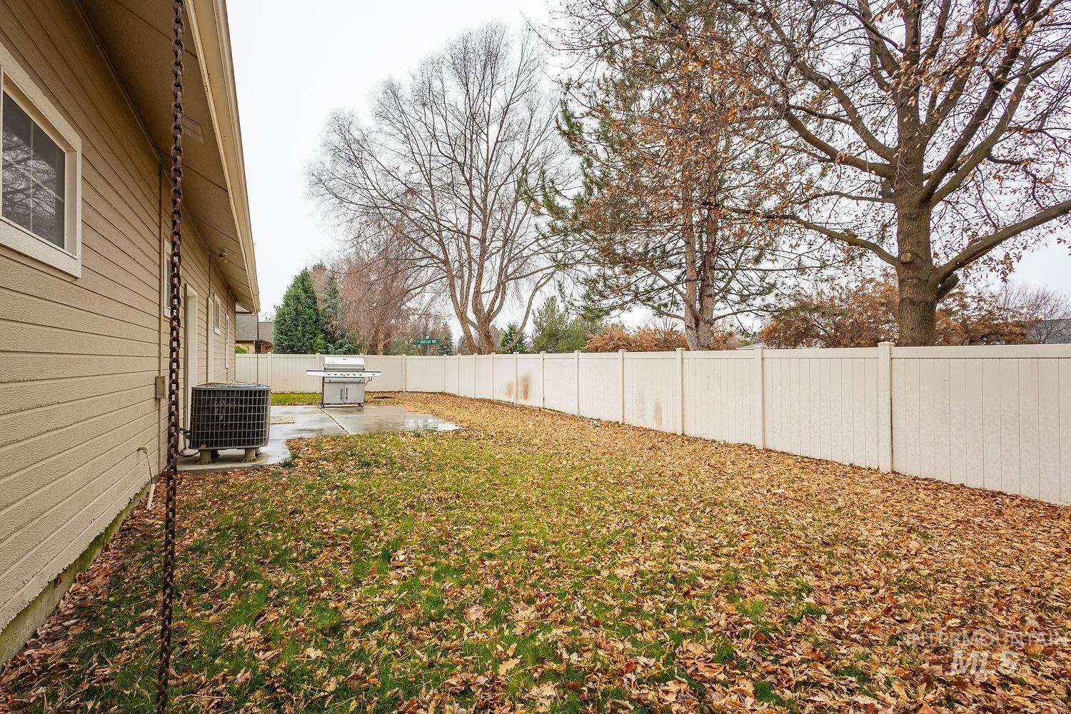 Fenced backyard with a patio area
