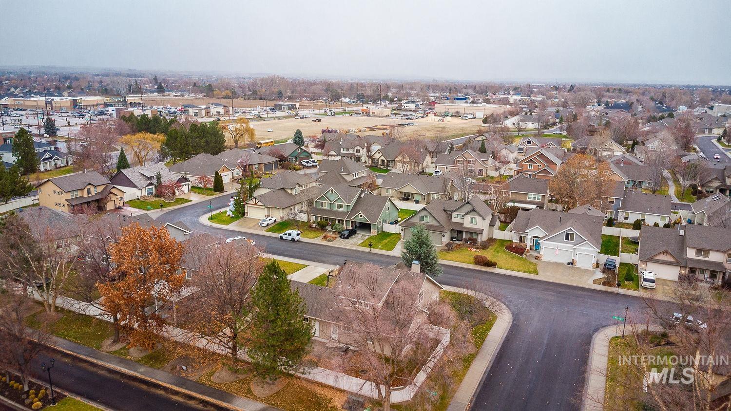 Aerial view of property's location featuring nearby suburban area