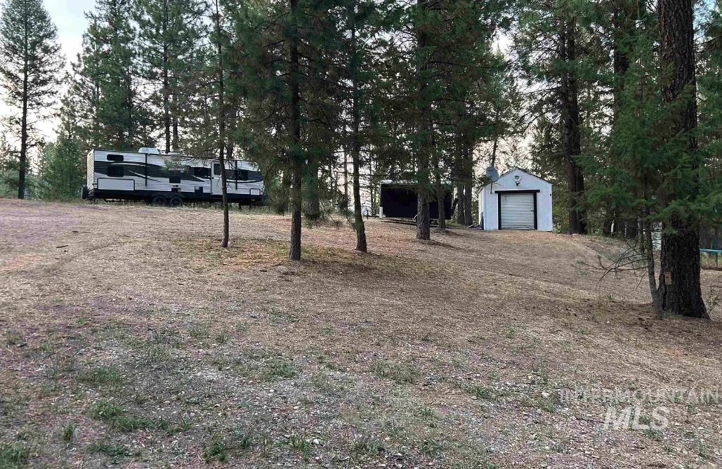 View of yard with an outbuilding