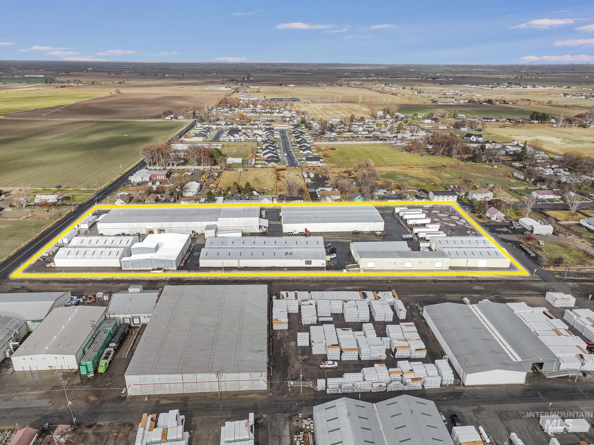 Aerial view of property's location featuring industrial structures and property boundaries highlighted