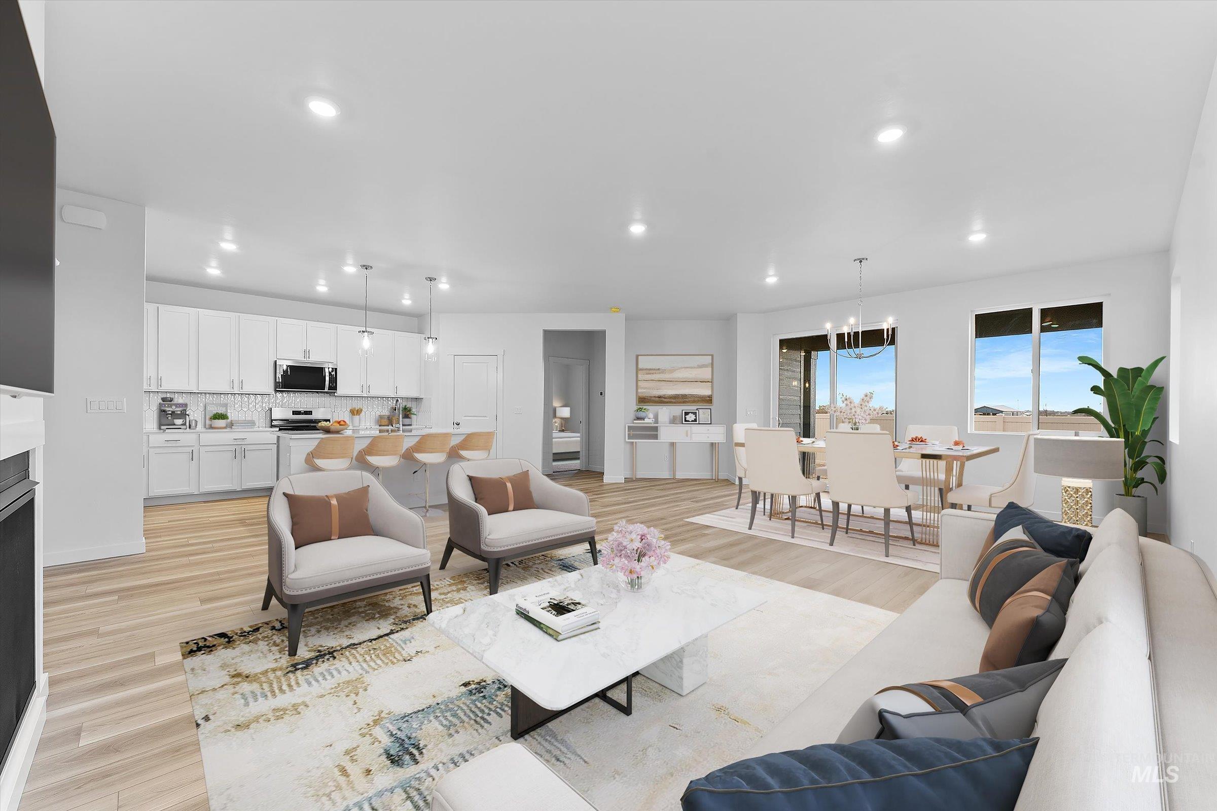 Living area featuring light wood-type flooring, recessed lighting, and a chandelier