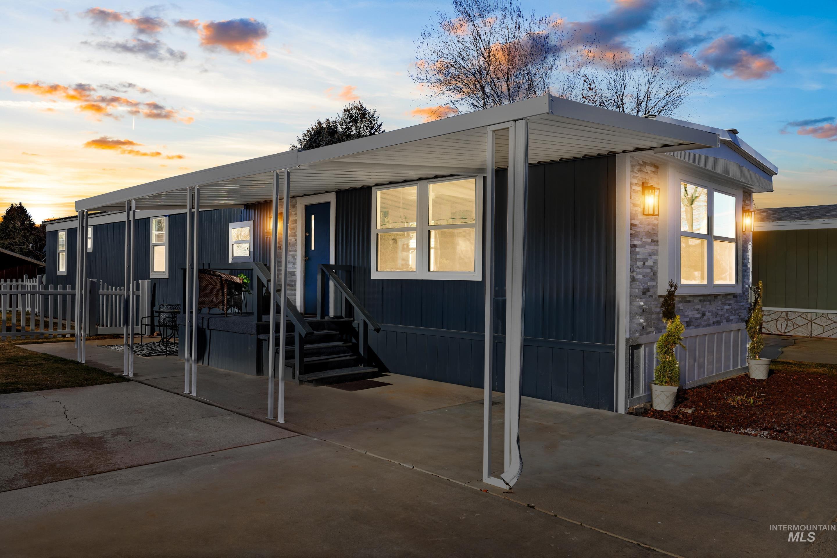 View of front facade featuring a patio and entry steps