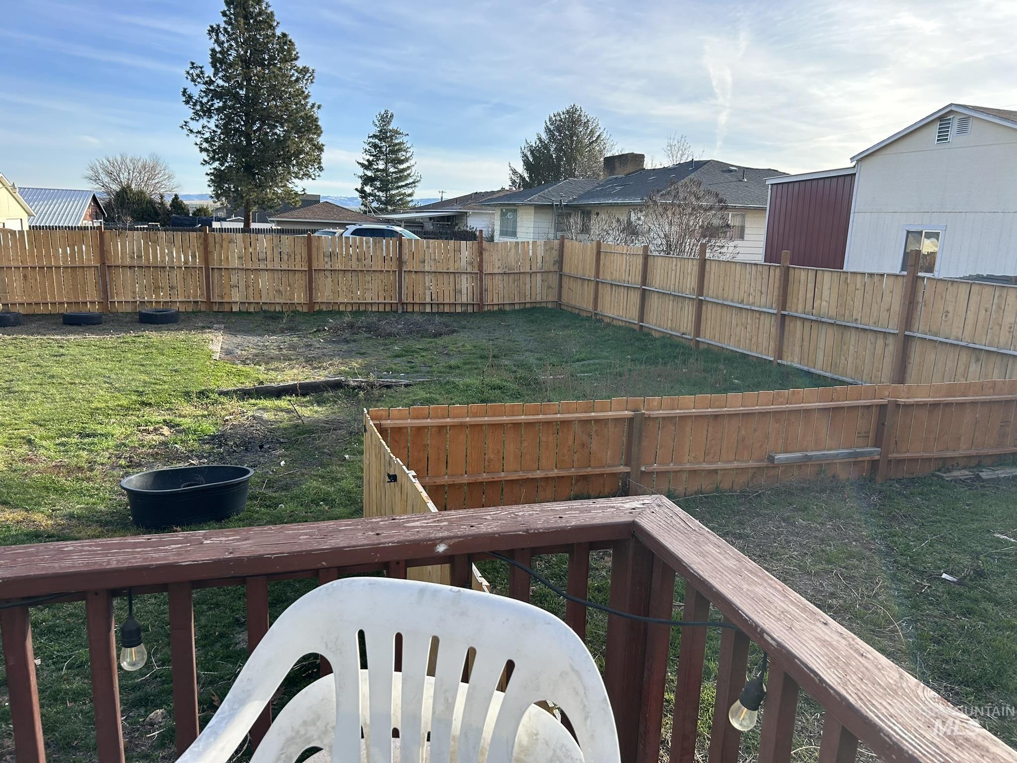 View of fenced backyard